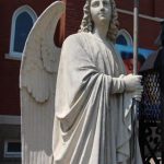 Angel in front of the Catholic church in Glasgow, Missouri