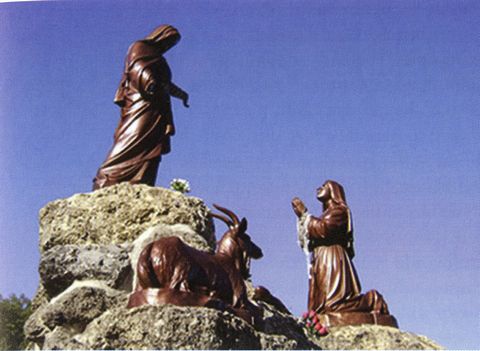 Statues located at the Laus apparition site commemorate the apparitions.